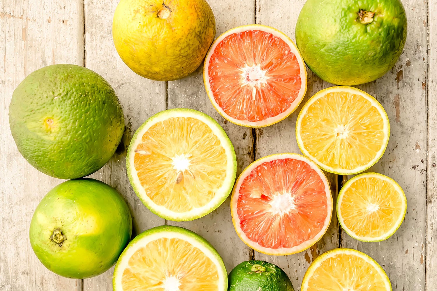 Fresh citrus fruits including oranges, lemons and grapefruit, illustrating citrus essential oil blending.